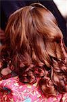 Back view of a woman, curled hair