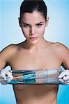 Young woman holding tray with syringe