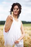 Portrait of young woman holding cereal bar