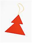 Red Christmas tree shaped decoration on white background