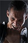 Close-up of Man Lifting Weights, Studio Shot