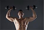 Muscular Man Lifting Weights, Studio Shot