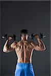 Muscular Man Lifting Weights, Studio Shot