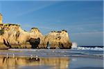 Natural Arch Rock Formations at Praia dos Tres Irmaos and Atlantic Ocean, Alvor, Portimao, Algarve, Portugal