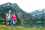 Mature couple hiking in mountains, Lake Vilsalpsee, Tannheim Valley, Austria