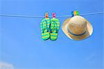 Straw hat beach sandals and blue sky