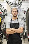 Worker in bicycle shop