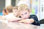 Portrait of boy leaning on elbows