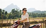 Woman on moped, Vang Vieng, Laos