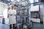 Portrait of scientist with lab equipment and machinery