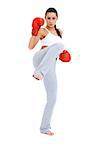 Full body shot of female kick boxer over white background