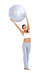 Woman doing exercises with fitness ball  she holding ball above her head