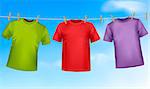 Set of colored t-shirts hanging on a clothesline.
