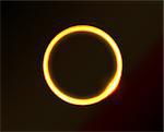 Vector yellow circle looks like ring of fire or sun in space. Dark background.