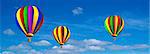Vector hot air colorful balloon on blue sky with white clouds. Background.