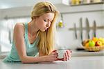 Young woman drinking coffee in the morning