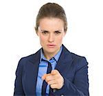 Concerned business woman pointing in camera