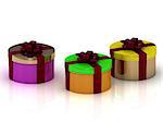 Round colorful gift boxes wrapped in a ribbon with a bow
