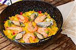 Paella in black pan  -traditional spanish rice dish