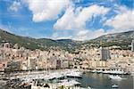 densely packed buildings and luxury yachts in Monte Carlo city, Monaco on the French Riviera