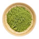 moringa leaf powder in a small ceramic bowl, isolated on white, top view
