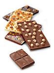 Various chocolate bars with nuts on white background
