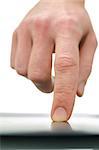 Detail of male finger using touch pad over white background. Front view.