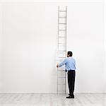 The corporate ladder - businessman at the start of carrier, begin climbing