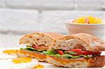 fresh ciabatta panini sandwich with eggs tomato lettuce