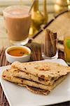 chapati Paratha Fold with traditional indian items background