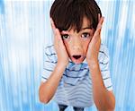 Boy standing while looking scared on blue digital background