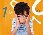 Boy looking scared against orange background with numbers