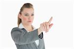 Businesswoman pointing on something in the air