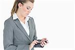 Businesswoman touching on smartphone while texting