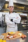 Pastry chef making dough in the kitchen