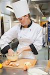 Woman kneading dough for the bread