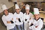 Team of Chef's standing in kitchen