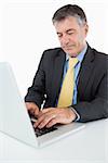 Businessman using laptop at desk