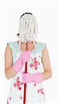 Woman hiding her face with a mop on a white background
