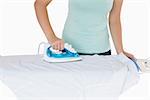 Woman ironing a shirt on a white background