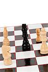 White pieces surrounding the black queen in chess