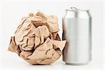 Empty can and crushed paper bag for recycling