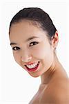 Young woman smiling with red lips on white background