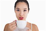 Woman holding a cup of coffee against white background