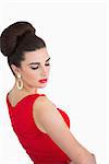 Glamorous woman wearing a red dress and earrings