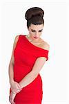 Brunette woman with red dress looking glamorous