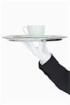 Cup of coffee on a silver tray on white background