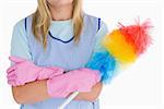 Cleaning woman holding feather duster in the white background