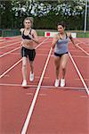 Women running a race on the race track