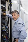 Technician working on data servers in the data center